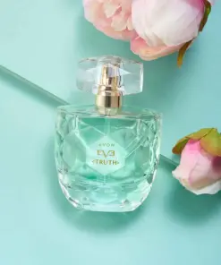 avon eve perfume bottle on green background