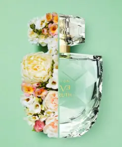 avon eve truth perfume perfume bottle design with flower half by half on a green background