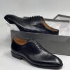 black polished patterned shoe