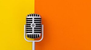 Stylish retro microphone for sale at Shopwice Ghana, set against a bright yellow and orange backdrop