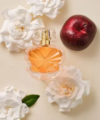 avon eve become edp bottle on floral background