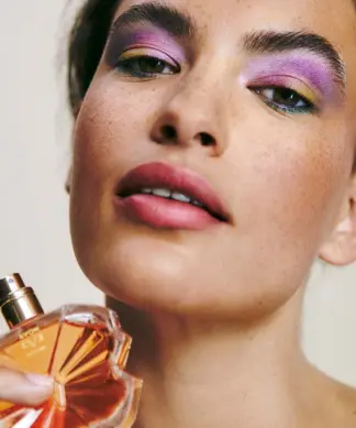 Avon Eve Become Eau de Parfum 50ml Shopwice model holding avon eve become bottle